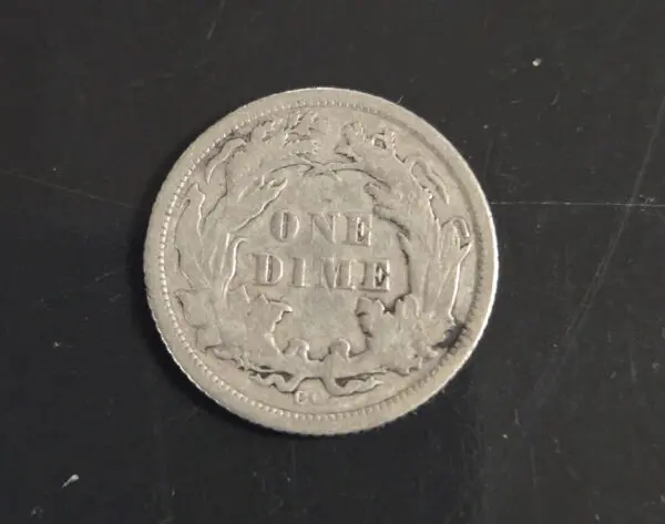 A coin that is sitting on the table.