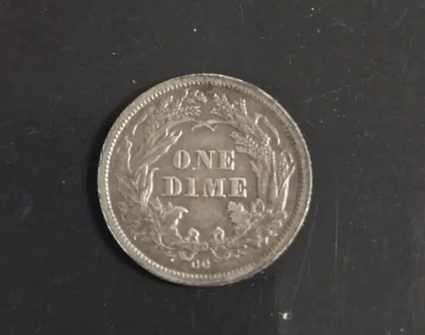 A coin that is sitting on the ground.