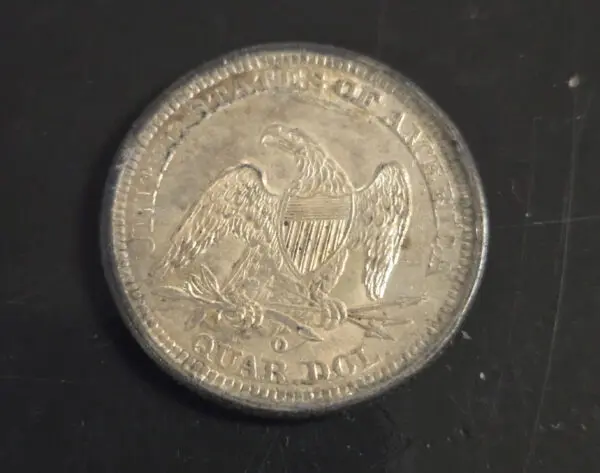 A coin that is sitting on the table.