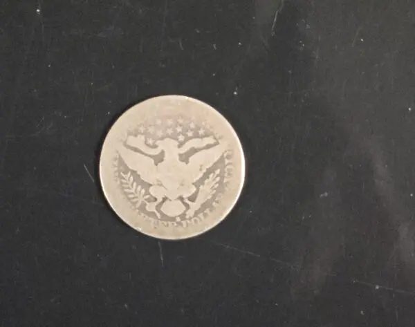 A coin that is sitting on the ground.